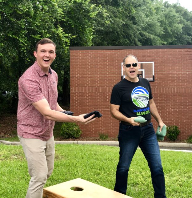 Jacob and Larry practicing corn hole before the IIMC Conference.