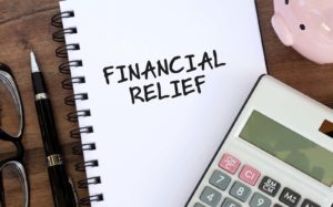 financial relief written on a notepad image