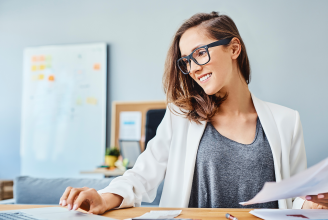 woman at office desk with papers