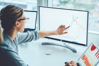 blog featured image with women looking at stats on a computer screen